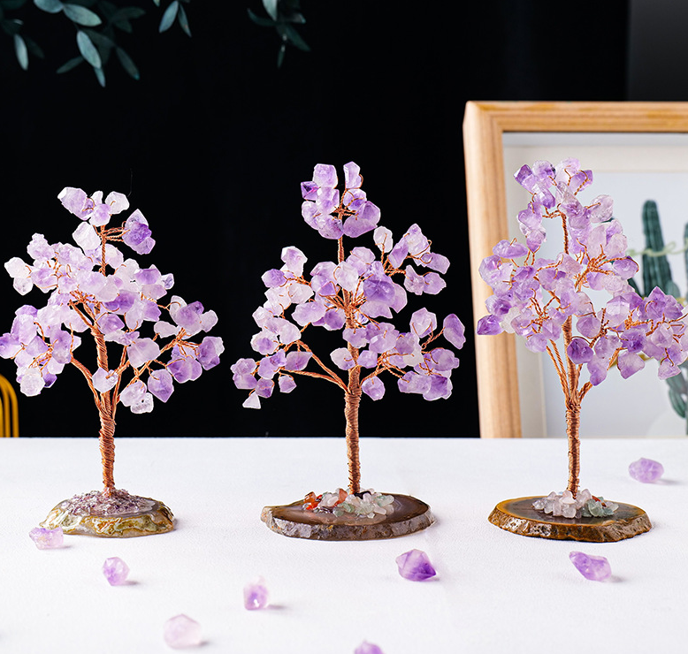 Amethyst crystal tree with raw cluster base close up