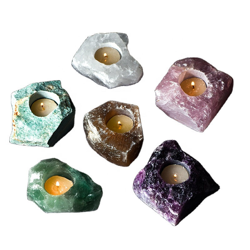 Raw crystal candle holder glowing light through stone formations